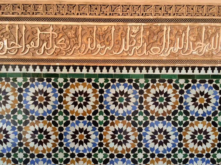 Zellige tilework and carved stucco at the Ben Youssef Madrasa, Marrakesh