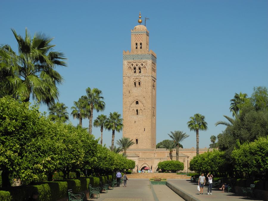 Minaret of the Koutoubia Mosque in Marrakesh, framed by palm trees